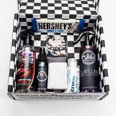 an open box containing men's grooming products on a white and black checkered surface