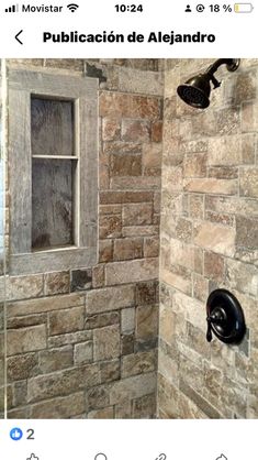 a bathroom with stone walls and a window in the shower stall is seen on instagram