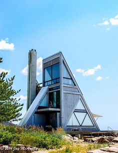 an unusual house on top of a hill