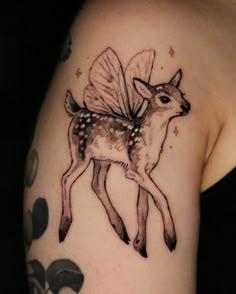 a deer with a bee on it's back and wings flying above its head