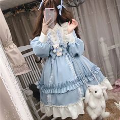 Brand Name: IngvnSilhouette: A-LINEOrigin: CN(Origin)Season: SpringNeckline: MANDARIN COLLARSleeve Style: Flare SleeveDecoration: BowStyle: Lolita StyleDresses Length: Knee-LengthMaterial: COTTONMaterial: PolyesterAge: Ages 18-35 Years OldSleeve Length(cm): FullGender: WOMENWaistline: empirePattern Type: PatchworkModel Number: Y658Style: Sweet Cute Kawaii Lolita Princess dressPopular elements: Ruffles,three-dimensional decoration,stitchingFabric material: Chiffon / Polyester (Polyester Fiber)Season: 2020 Spring NewColor: Blue And CoffeeSize: M,LNote1: Dress + Bow On Chest + Bear DollNote2: No Headdress + rabbit bag + socks + shoes Harajuku Style Ruffle Dresses For Costume, Ruffled Dress For Spring Cosplay, Spring Ruffle Dress For Cosplay, Spring Cosplay Dress With Doll Collar, Kawaii Ruffled Costume Dress, Kawaii Ruffle Costume Dress, Winter Party Harajuku Style Dress, Harajuku Style Winter Party Dress, Kawaii Dress With Doll Collar For Costume Party