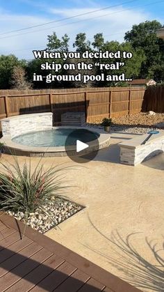 an outdoor hot tub in the middle of a backyard