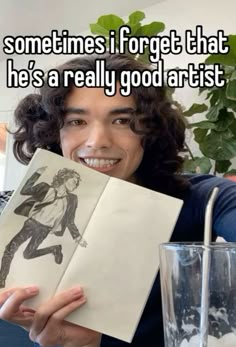 a person holding up an open book with the caption sometimes forget that he's a really good artist