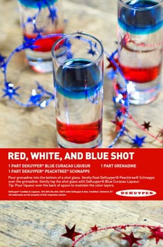 red, white and blue shot in glasses on a wooden table with stars around it