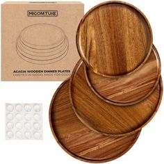 the wooden plates are stacked on top of each other and ready to be used as coasters