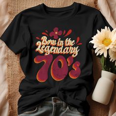 Celebrate a milestone with our "Born in the Legendary 70s" shirt, the perfect 50th birthday gift for someone who proudly embraces their age! This retro birthday shirt not only showcases a fun design but also reflects the rich culture of the 1970s. Made with high-quality materials, our vintage birthday tee is a wonderful addition to any wardrobe. Whether you're looking for a shirt to wear at a birthday party or a stylish reminder of being aged to perfection, this born in the 70s t-shirt makes a t Vintage Cotton Tops For Anniversary, Vintage Letter Print Tops For Anniversary, Retro Graphic Print Tops For Anniversary, Vintage Short Sleeve Tops For Gift, Vintage Crew Neck Top As Gift, Retro Letter Print Tops For Gifts, Vintage Text Print Top For Birthday, Retro Letter Print Tops As Gift, Vintage Graphic Print Tops For Gifts