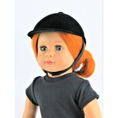 the doll is wearing a black hat and gray shirt with an orange pony tail on it's head