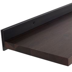 a close up view of a wooden shelf with metal brackets on it's sides