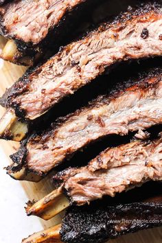 grilled steak on a cutting board with onions