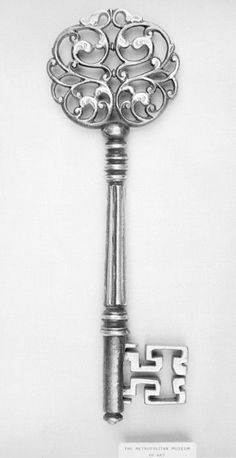 an ornate key with the letter f on it's side is shown in black and white