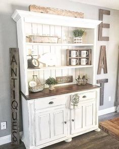 a white hutch filled with lots of items