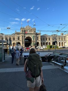 people walking in front of a train station