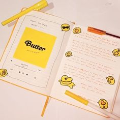 an open notebook with the word butter on it and emoticting smiley faces in yellow