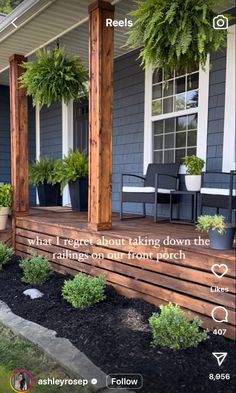 the front porch is decorated with potted plants and an advertise for real estate