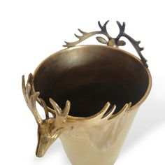 two deer heads are placed in a bowl