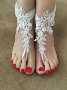 the feet are decorated with white lace and flowers