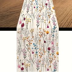 an ironing board with flowers on it