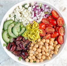 a white bowl filled with different types of vegetables