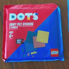 a bag of dots craft felt stickers on a table