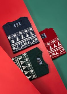 three christmas sweaters on red and green background