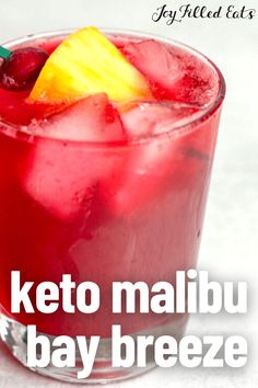 a red drink with a pineapple garnish on the top and text that reads keto malibu bay breeze