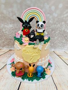 there is a cake with animals on it