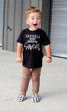 Trouble never looked so sweet! and boy does it look sweet on our kids! Every parent can relate to this tee, that sweet little mischievous face, you can't even be upset at the trouble they create. We use high quality Kavio brand blanks which do run slim so please refer to the size chart to ensure you are ordering the right size. --->This shirt is screen printed in our home studio, in Charleston, SC. Every shirt's design placement will be different. All Designs are measured at the same size, de Baby Mode, Funny Kids Shirts, Trendy Kids Outfits, Boys And Girls Clothes, Boys Graphic Tee, Screen Printing Shirts, Vinyl Shirts, Trendy Kids, Kids Graphic Tees