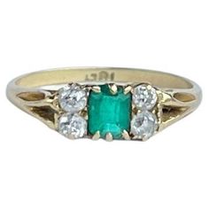 The central emerald is so bright and beautiful and measures 40pts. Sat either side it are pairs of bright shimmering old mine cut diamonds each measuring 7pts. The ring is modelled in 18ct gold. Ring Size: L 1/2 or 6 Height Off Finger: 3mm Weight: 2.3g Art Deco Emerald, Luxury Old Money, Bright And Beautiful, Quiet Luxury, Classy Chic, Three Stone Rings, Emerald Diamond, Three Stone, Old Money