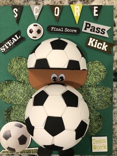 a soccer themed card with a paper cut out of it's face and ball