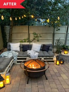 a fire pit sitting in the middle of a patio surrounded by pillows and lights on top of wooden pallets