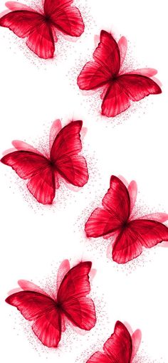 four red butterflies flying in the air with dots on them and one has its wings spread out