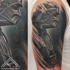 the tattoo on this man's arm depicts darth vader and his helmet