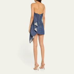 LaQuan Smith strapless denim mini dress features a ruched ruffle detailing at the side  Sleeveless Hem falls above the knee Bodycon silhouette  Back zip closure  Cotton Made in USA Spring Denim Party Dress, Spring Party Denim Dress, Chic Denim Dress For Party, Chic Denim Party Dress, Chic Party Denim Dress, Elegant Denim Party Dress, Chic Evening Denim Dress, Elegant Sleeveless Denim Mini Dress, Denim Evening Dress For Spring