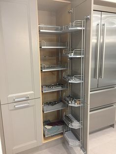 a kitchen with stainless steel appliances and drawers