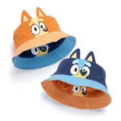 two children's hats with cartoon faces on the front and back, one is blue and orange