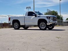 a white truck parked in a parking lot