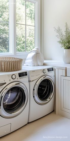 a washer and dryer sitting next to each other in front of a window