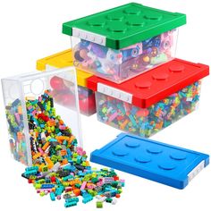 three plastic storage containers filled with legos and lots of different colored blocks in them