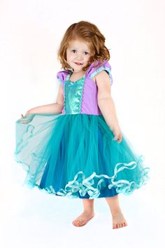 "Ariel dress, Ariel costume, MERMAID dress, Ariel TUTU DRESS This is a fun Mermaid inspired tutu dress for your little girl. This dress has a sweetheart neckline, inset details, cute gathered strap sleeves and teal tutu skirt. The back has elastic and a waist tie for a cute fit that is comfortable to wear as well as cute. The skirt has a full layer of tulle with a full cotton/poly underlining for comfort and lots of twirling. The tutu skirt is trimmed with ribbon. This dress is machine wash cold Rapunzel Mermaid, Ariel Dress Costume, Ariel Tutu Dress, Cinderella Dress For Girls, Little Mermaid Dress, Princess Ariel Dress, Princess Dress Patterns, Ariel Costumes, Mermaid Tutu