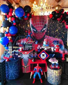 a spiderman birthday party with balloons and decorations