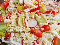 a salad is shown with tomatoes, cucumbers, and celery