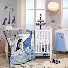 a baby's room decorated in blue and white