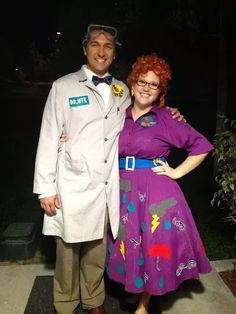 a man and woman dressed up in costumes