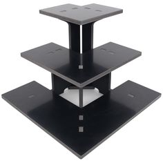 three tiered black metal shelf with white square holes on each side and two shelves at the top