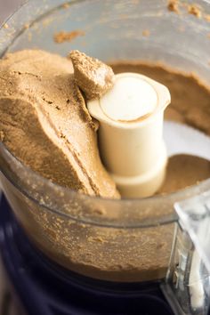 a food processor filled with something brown and ready to be blended