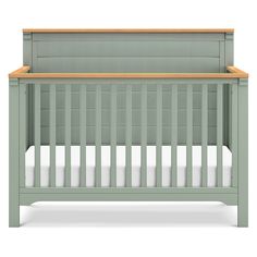 a baby crib with a wooden top and bottom rail, in light green color