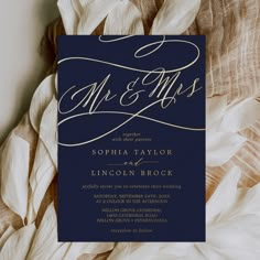 an elegant navy and gold wedding card with the word mr and mrs printed on it