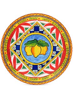 a colorful plate with fruit painted on it