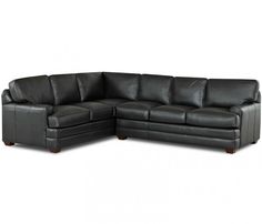 a black leather sectional sofa with two recliners and one end facing the couch