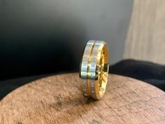 two tone gold and silver wedding band with roman numerals on the inside side